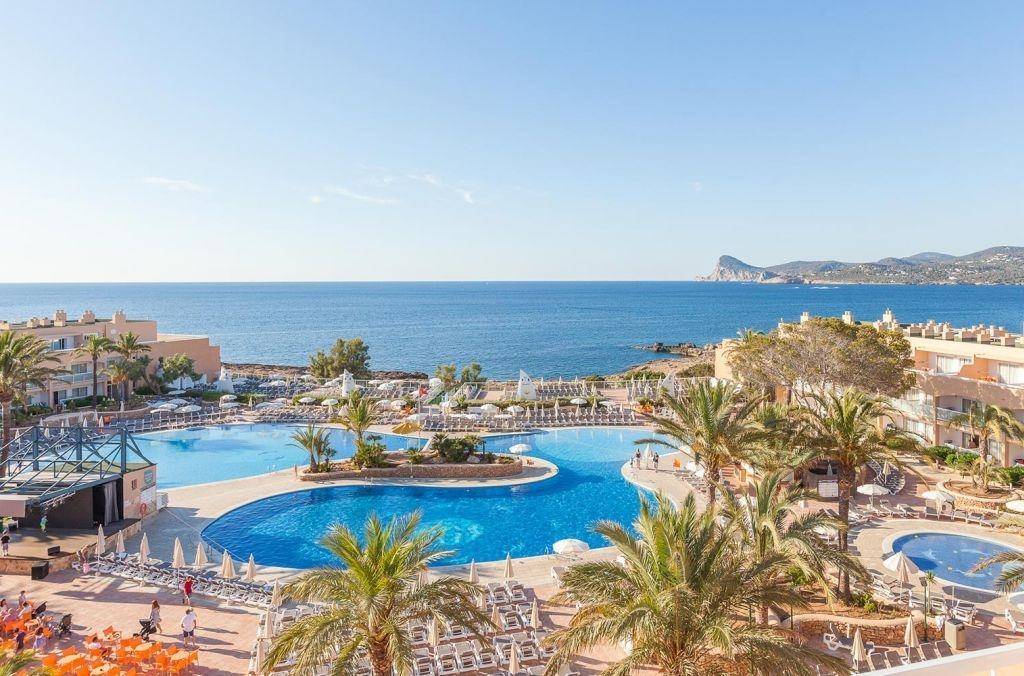 an aerial view of the pool at a resort in mallorca.